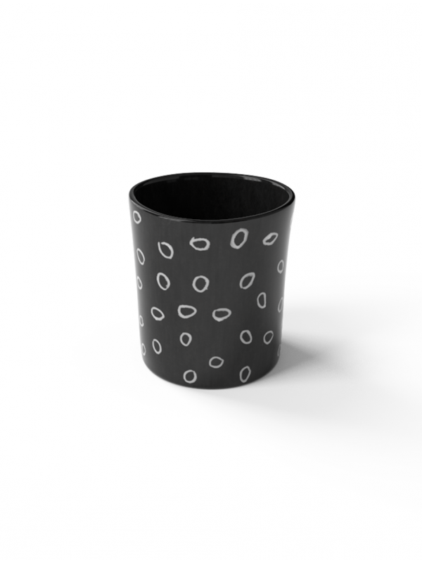 Beaker with circle sgraffito patterns made with black porcelain